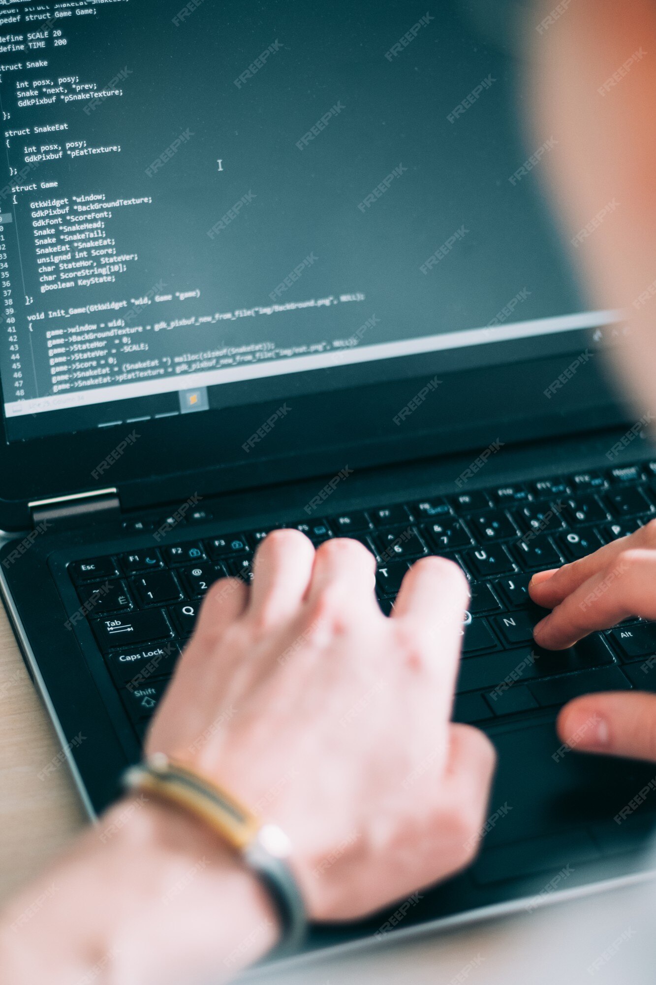 Premium Photo | Programmer writing code on laptop keyboard