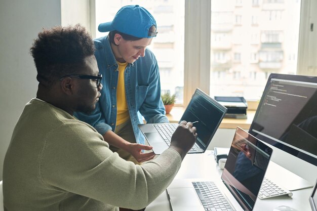 Photo programmers developing software in team