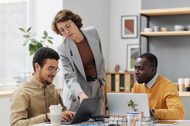 Photo programmers working in team at office