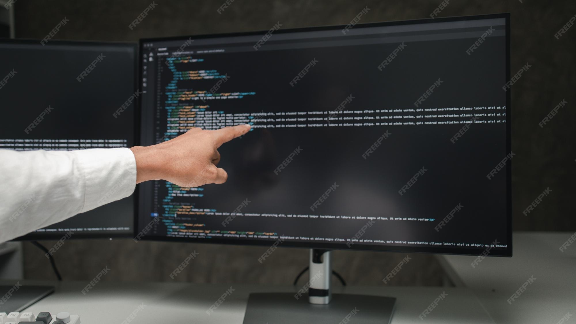 Premium Photo Programmers write programs on the computer designing