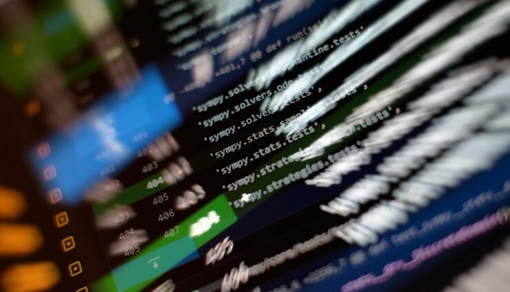 Photo programming code on computer screen software development writing program code on computer