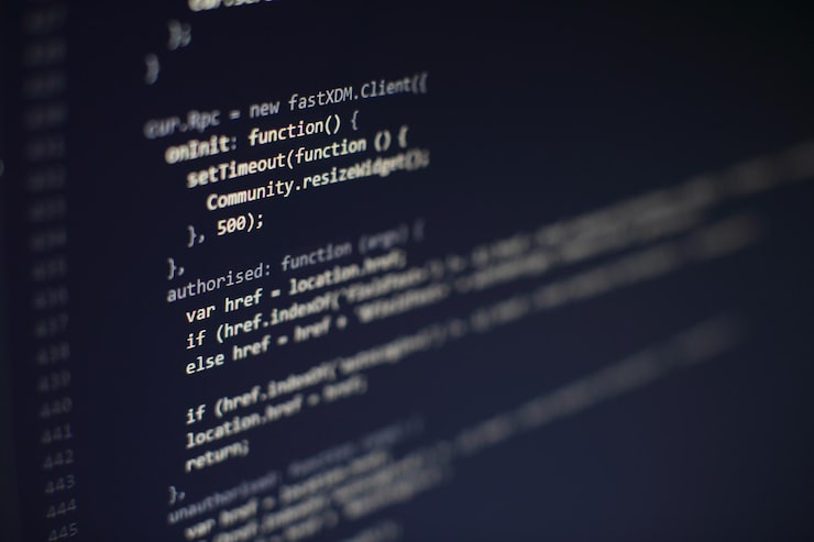 Photo programming code on computer screen. software development. writing program code on computer.