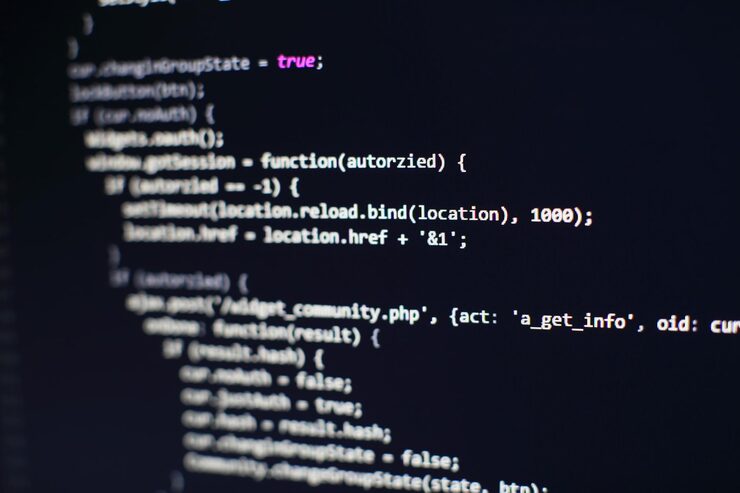 Photo programming code on computer screen. software development. writing program code on computer.