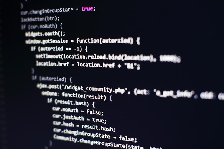 Photo programming code on computer screen. software development. writing program code on computer.