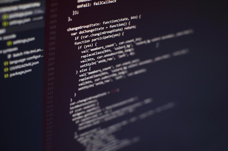 Photo programming code on computer screen. software development. writing program code on computer.