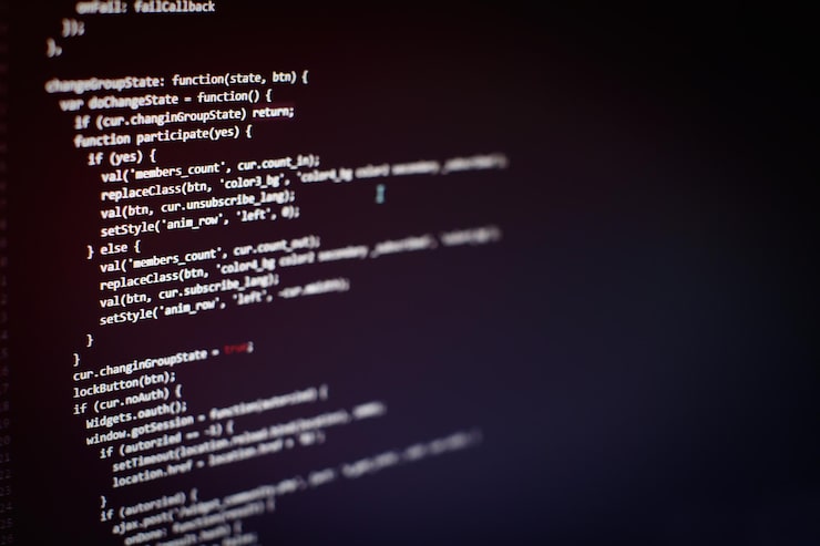 Photo programming code on computer screen. software development. writing program code on computer.