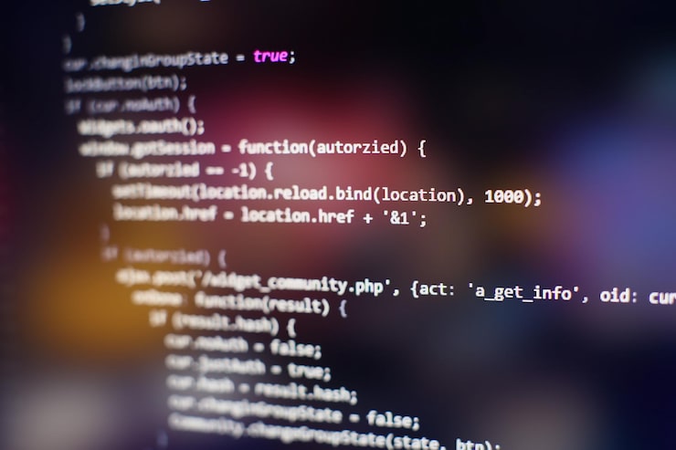 Photo programming code on computer screen. software development. writing program code on computer.