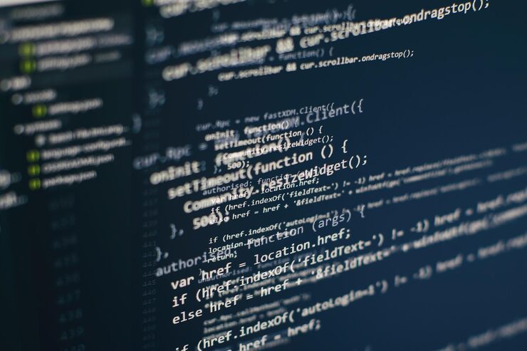 Photo programming code on computer screen. software development. writing program code on computer.