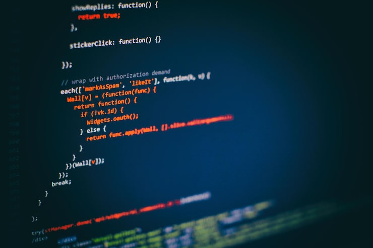 Photo programming code on computer screen. software development. writing program code on computer.