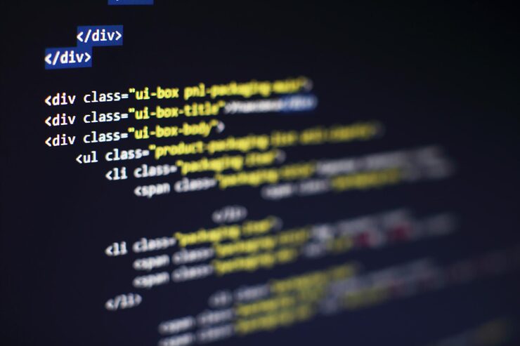 Photo programming code on computer screen. software development. writing program code on computer.