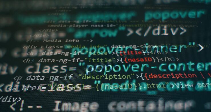 Photo programming code screen of software developer. software programming work time. code text written and created