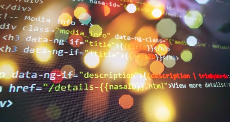 Photo programming code screen of software developer. software programming work time. code text written and created
