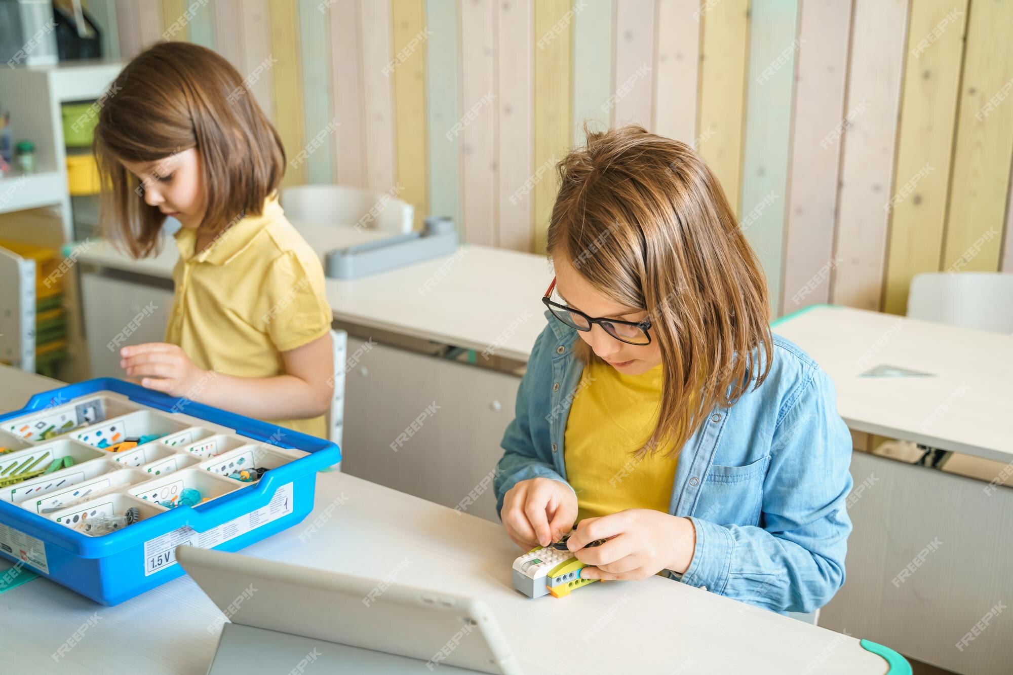Premium Photo | Programming work learning robotics in elementary school ...