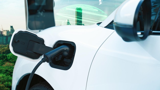 Progressieve groene stad ESG symbool achtergrond met elektrisch voertuig
