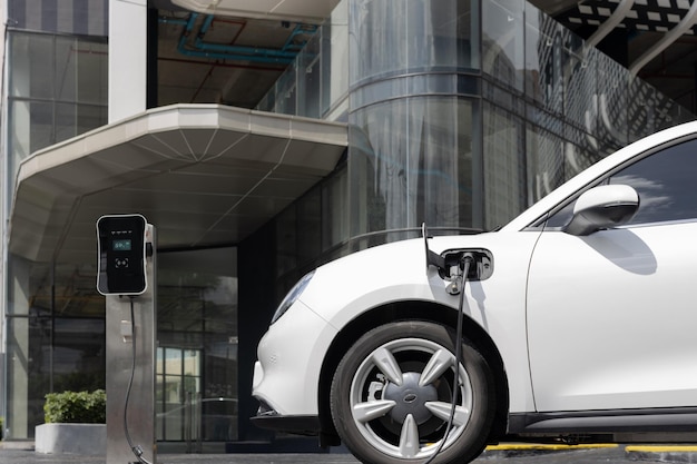 Progressive EV car at city residential with electric charging station