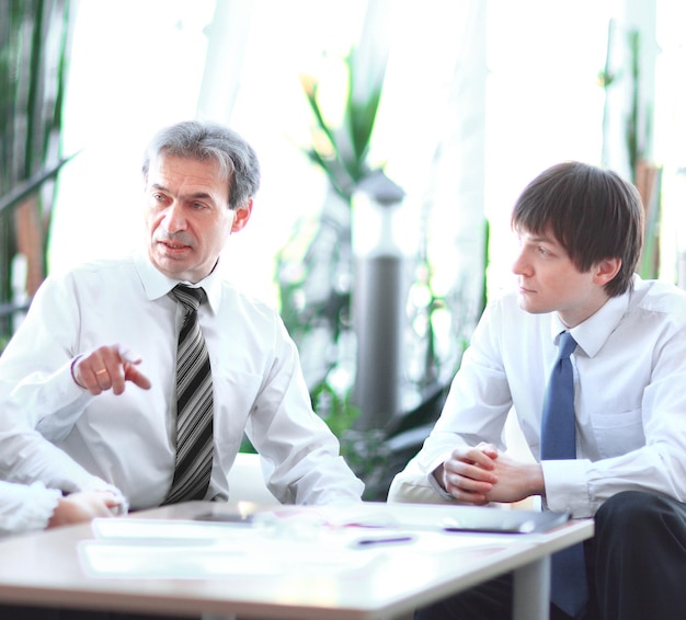 Project leader talking to business team in the workplace