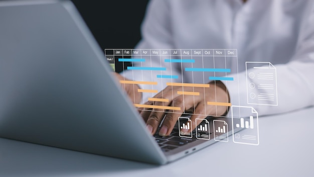 Project management tool and work schedule concept Planning software Businesswoman use laptop to manager working projects and update task with gantt chart schedule to business plan and progress