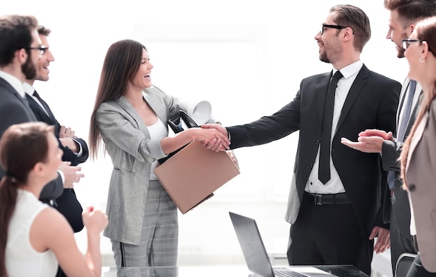 Project Manager shaking hands with the new employee