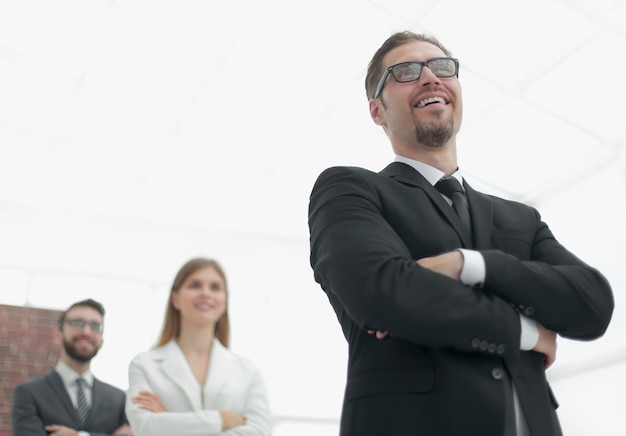 Project Manager standing in front of his business teamphoto with copy space