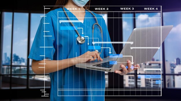 Foto project manager che lavora e aggiorna le attività con diagramma di gantt pianificazione diagrammasuccesso medico intelligente che lavora con successo medico intelligente che lavora