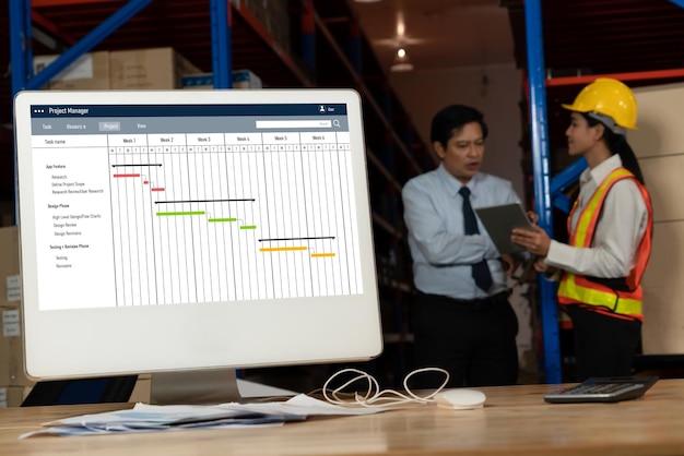 Photo project planning software for modish business project management on the computer screen showing timeline chart of the team project