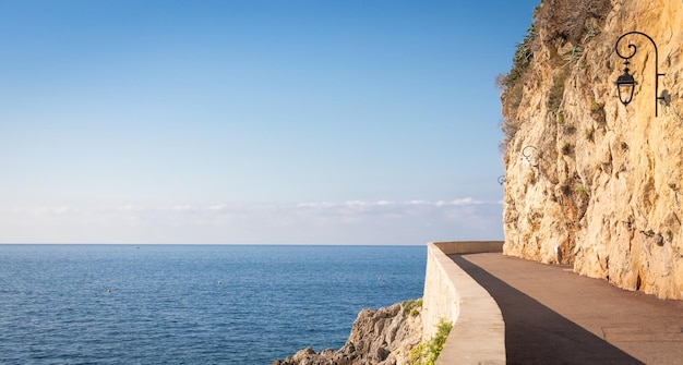 Promenade in front of the sea Blue sky on scenery seascape Concept of travel adventure freedom