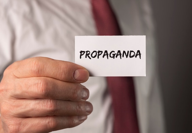 Propaganda word on paper manipulation and brainwash campaign by media concept