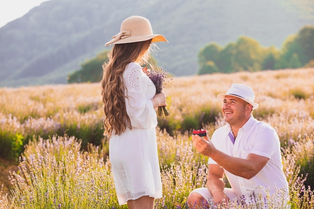 Proposal on lavender field at the sunset
