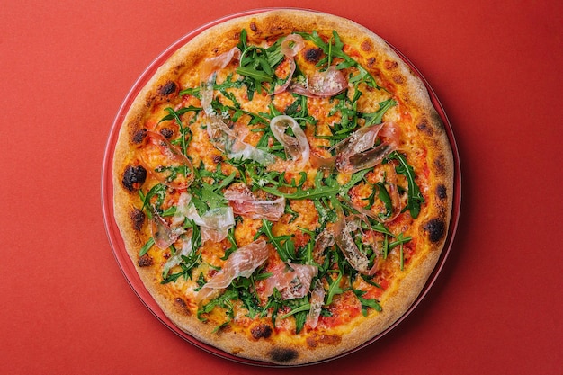 Prosciutto pizza or pinza with arugula in roman style