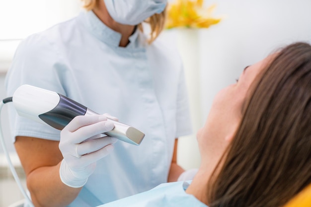 Prosthodontics Dentist Using 3D Dental Camera for Scanning Teeth