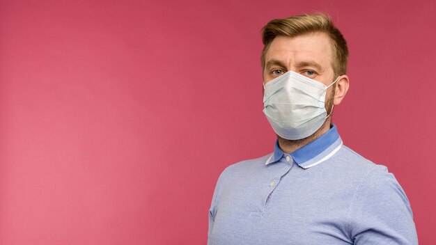 Protection against contagious disease, coronavirus. Man wearing hygienic mask to prevent infection