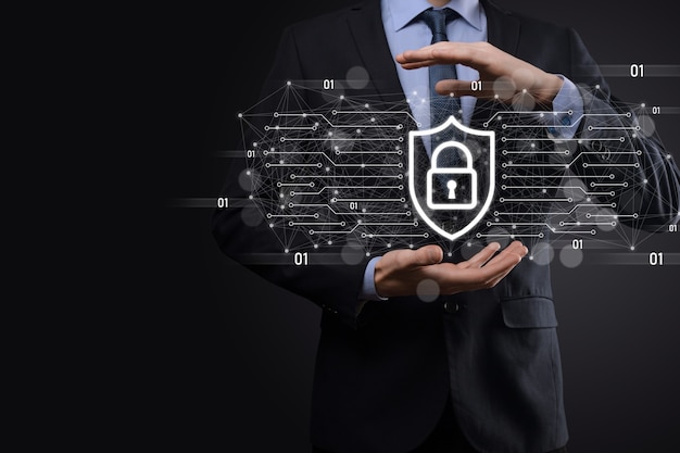 Protection network security computer and safe your data concept, Businessman holding shield protect icon. lock symbol, concept about security, cybersecurity and protection against dangers