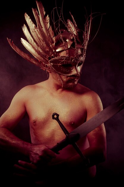 Protection, warrior with golden mask and huge iron sword, body covered with gold dust