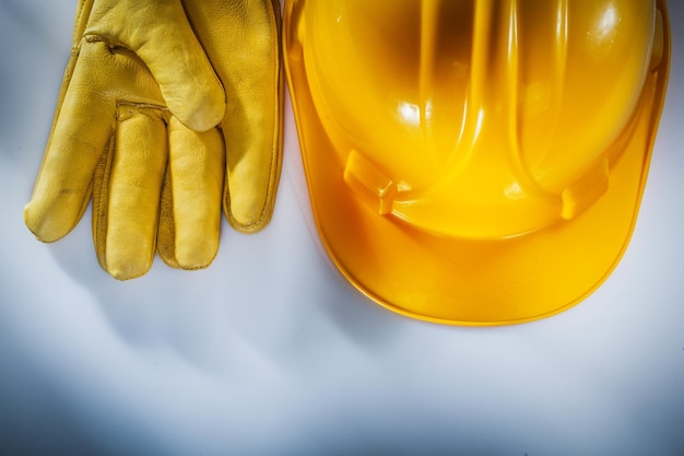 Protective gloves hard hat on white background.