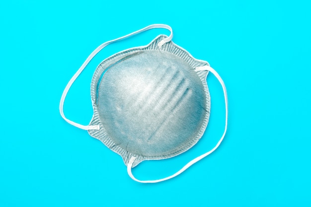 Protective gray medical mask isolated.