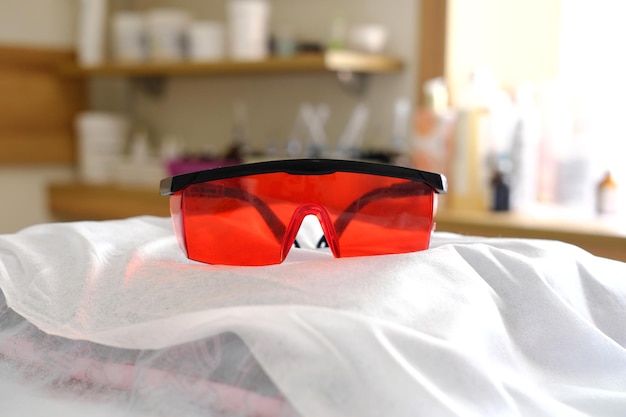 Protective red glasses UV protection in cosmetology dentistry laser depilation teeth whitening