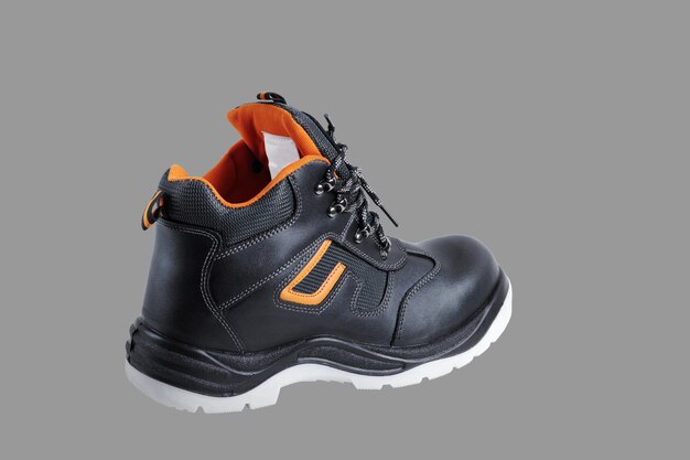 Photo protective safety shoe closeup isolated on a gray background