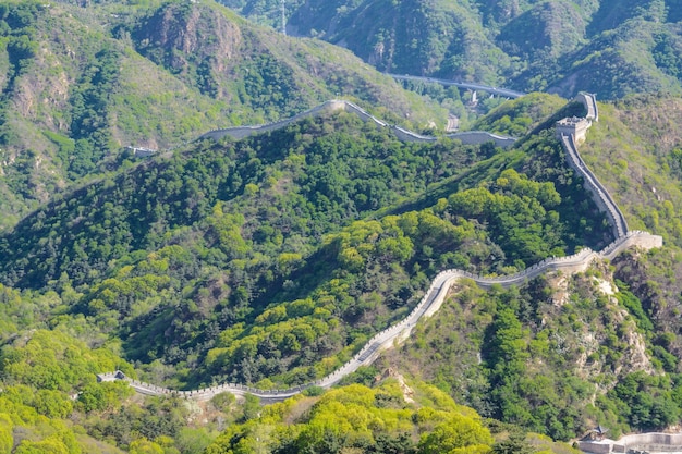 The protective wall goes like a snake over the hills beautiful view of the mountains and the wall