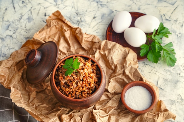 Protein rich food healthy breakfast healthy food concept diet\
buckwheat porridge in a pot boiled eggs
