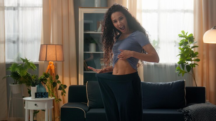 Proud amazed smiling hispanic ethnic woman happy sportswoman female fitness girl wearing old big