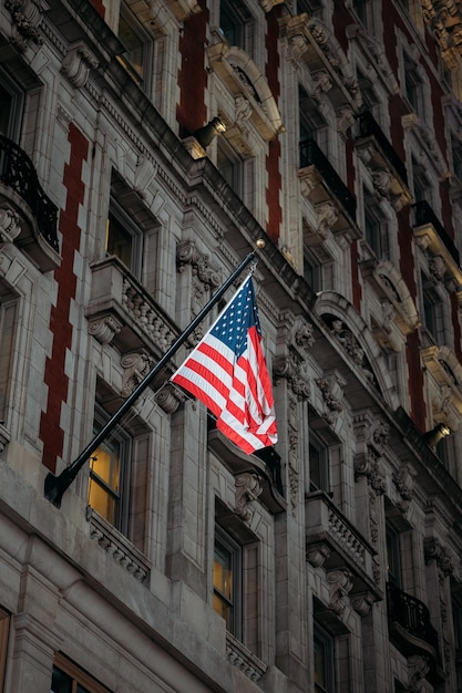 Proud american flag hanging from traditional new york architecture