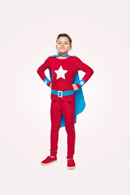 Proud boy in bright superhero costume