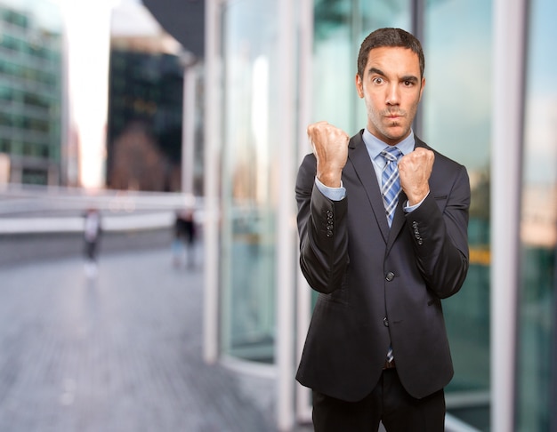 Proud young businessman challenging