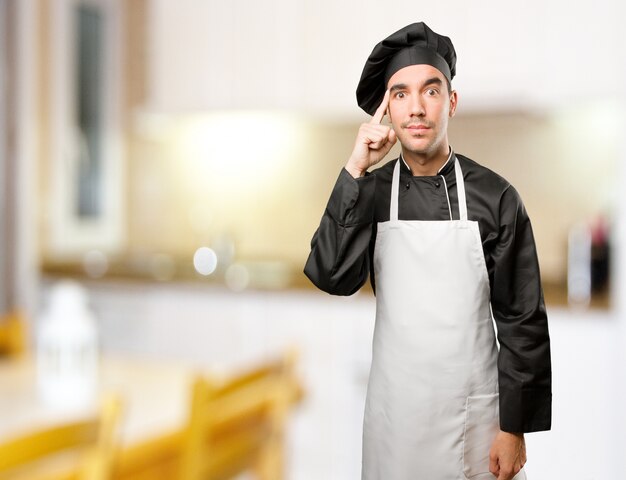 Proud young chef doing a concentration gesture