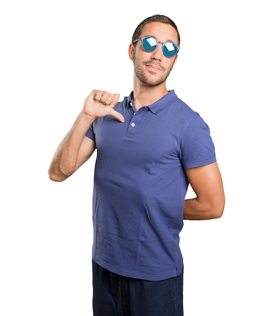 Proud young man on white background