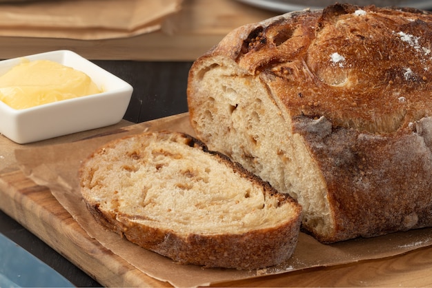 Proving delicious baked bread with butter.