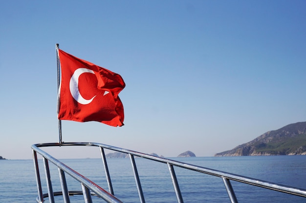 Prow of the yacht with the turkish flag in the sea excursion on the ship