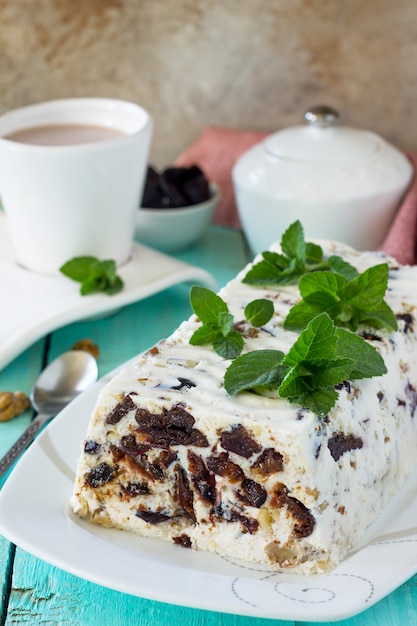 Prune Panna cotta with walnut and mint