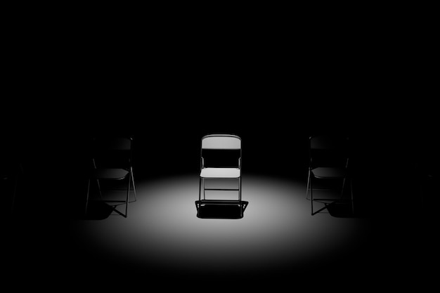 사진 스포트라이트를 받은 어두운 방이 있는 심리 보조 의자