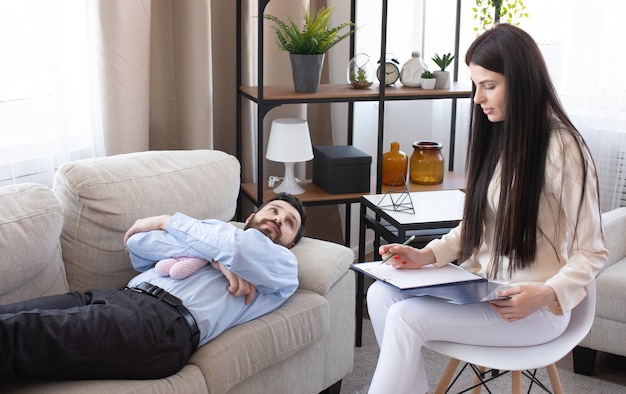 Psychologist having session with her patient in her private consulting room.